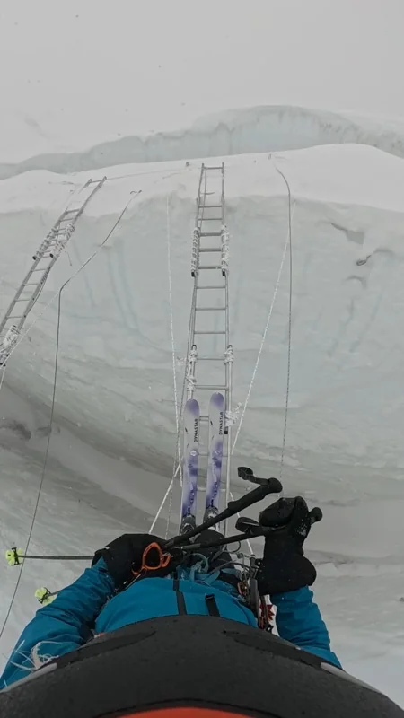 A ladder set into an ice wall in the Khumbu Icefall, seen from the climb