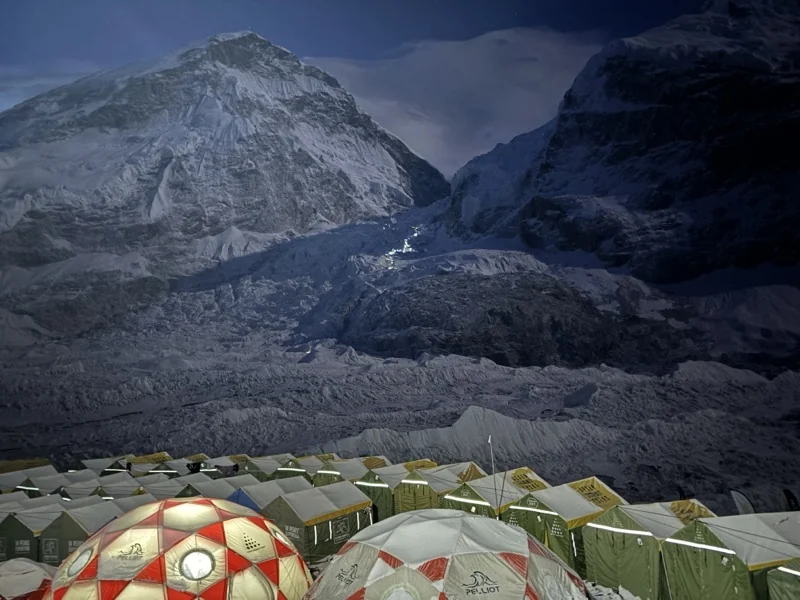 Base Camp tents at night, the mouth of the Khumbu Icefall above them